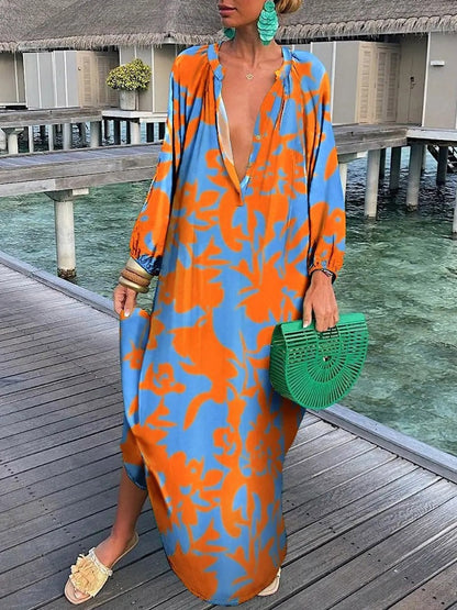 Long flowing women's floral maxi dress in bohemian style, ideal for casual summer fashion.