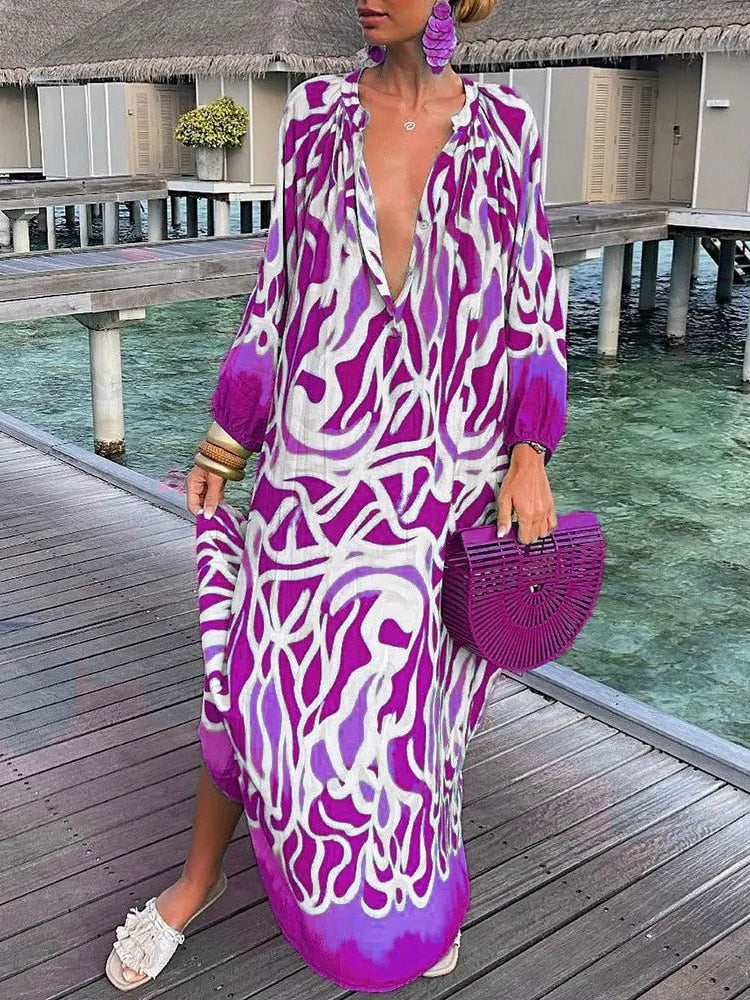 Effortless women's summer maxi dress featuring a vibrant boho floral print, great for beachwear.