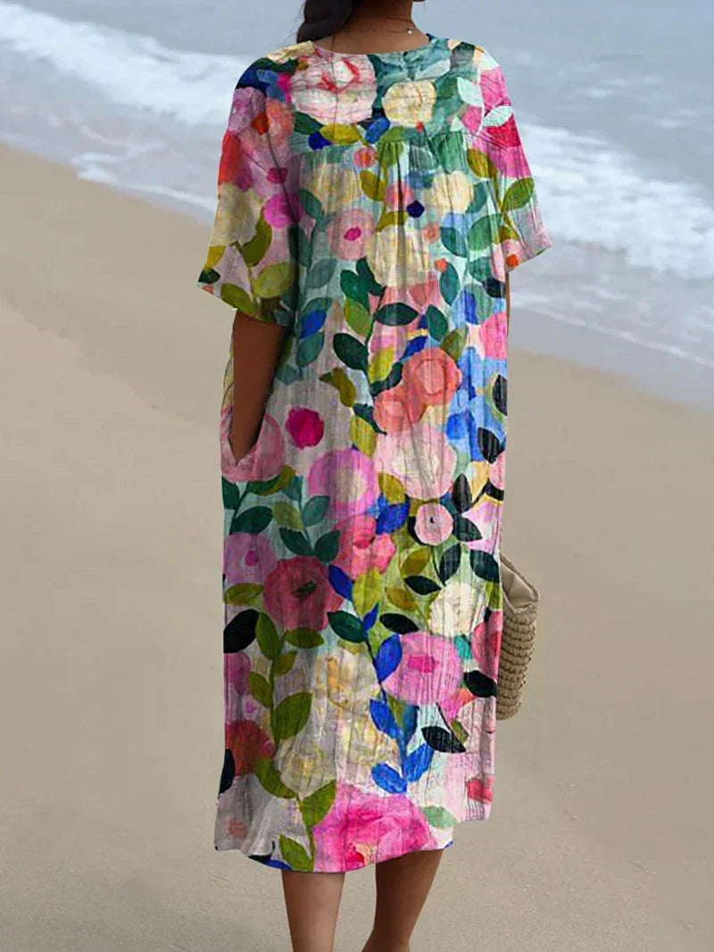 Comfortable women's floral print flowy midi dress with short sleeves, ideal for garden parties & summer fashion.