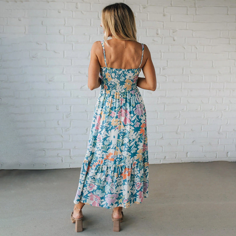 Casual women's floral maxi dress, ideal for summer vacation. Smocked bodice, sleeveless design & ruffled hem for comfort.