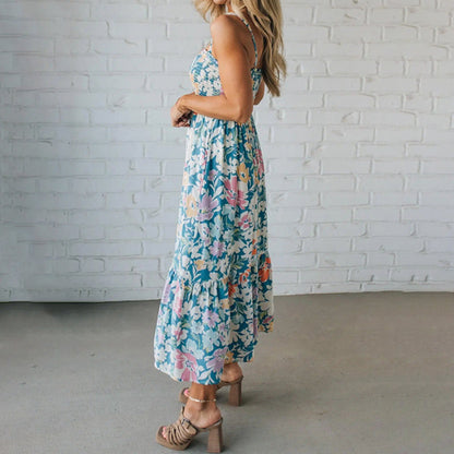 Elegant women's floral maxi dress with vibrant print. Smocked sleeveless design, ruffled hem, perfect for summer fashion.