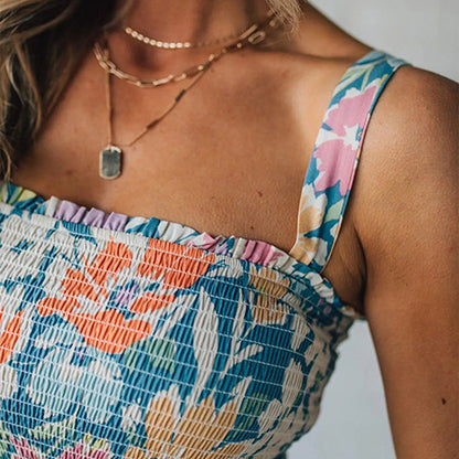 Sleeveless smocked floral maxi dress for women. Vibrant summer style, casual & comfortable with a lovely ruffled hem.