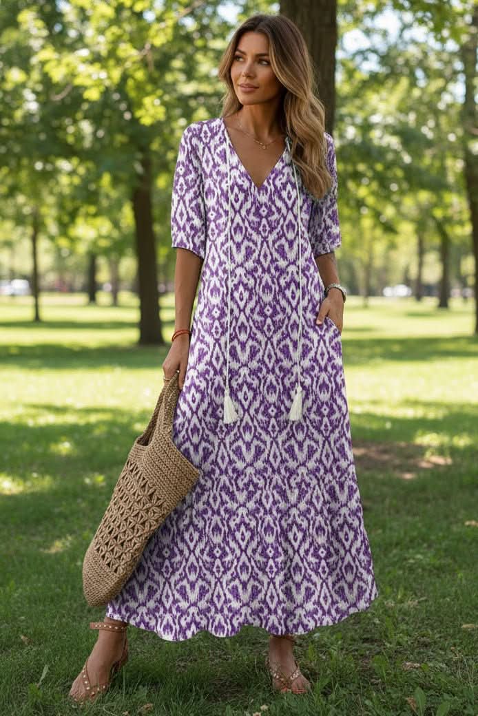 Full-length women's vibrant maxi dress. Flowy, elegant summer style, great for casual days, beach, or vacation.