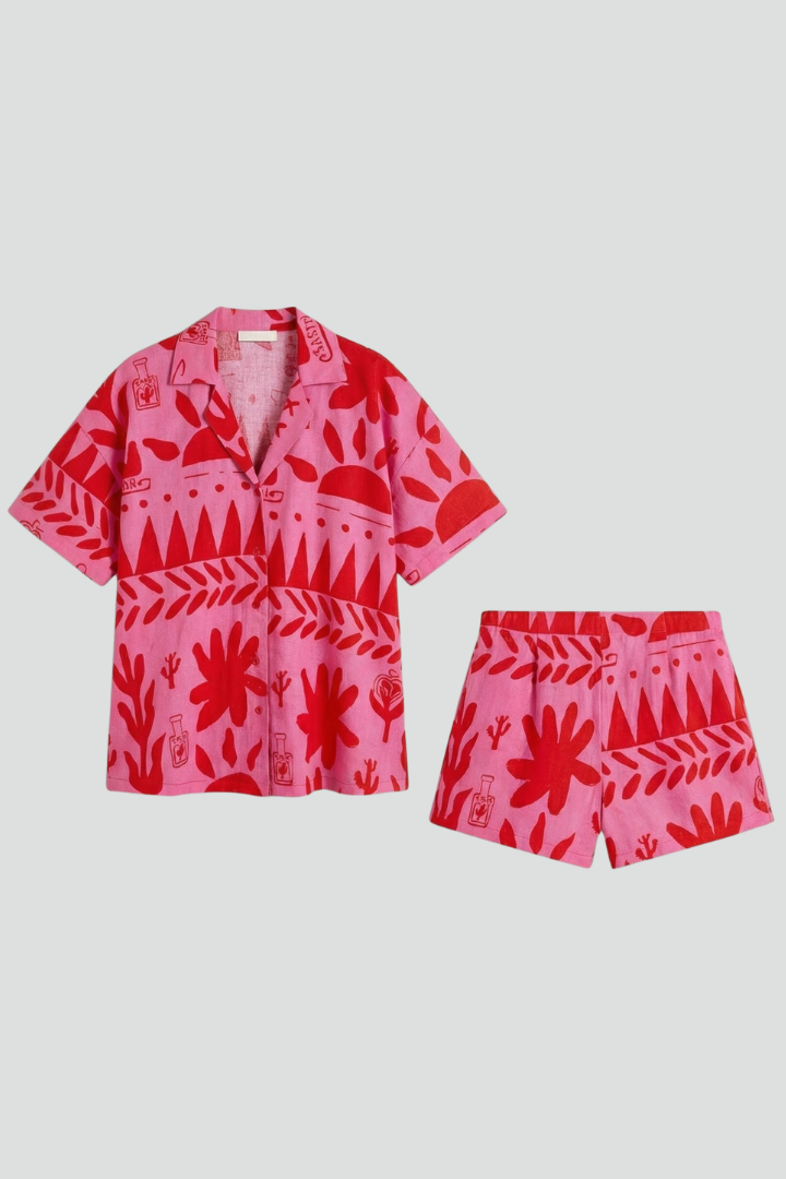 Vibrant women's tropical print camp collar shirt & matching shorts co-ord set for summer beach vacations.