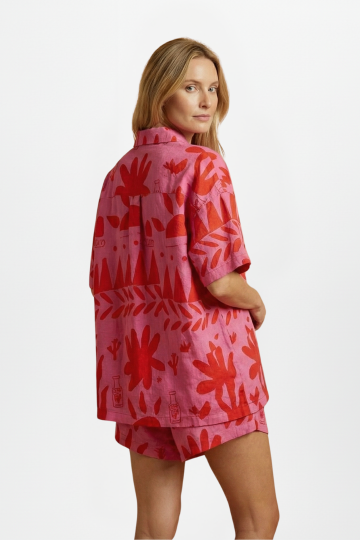 Stylish tropical print camp collar shirt paired with matching shorts for a women's summer outfit.