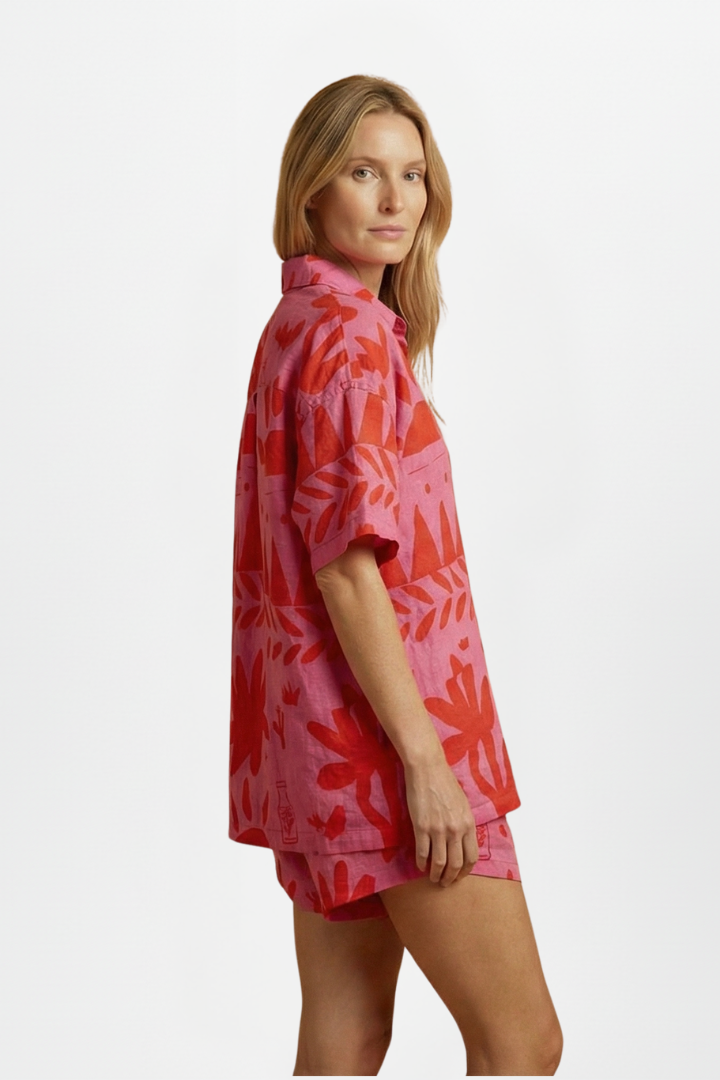 Flowy women's tropical print co-ord set with camp collar shirt & shorts for a vibrant beach look.