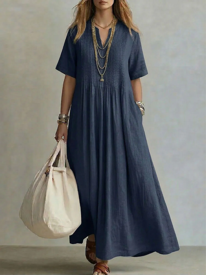 Elegant women's vibrant V-neck midi dress. Flowing fabric ensures comfort & stylish looks for any occasion.