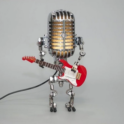Artistic metal robot table lamp, designed as a vintage microphone & guitar player, offering unique lighting.