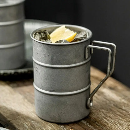 Vintage steel mug, durable and stylish, perfect for camp or daily coffee. Great gift for drinkware enthusiasts.