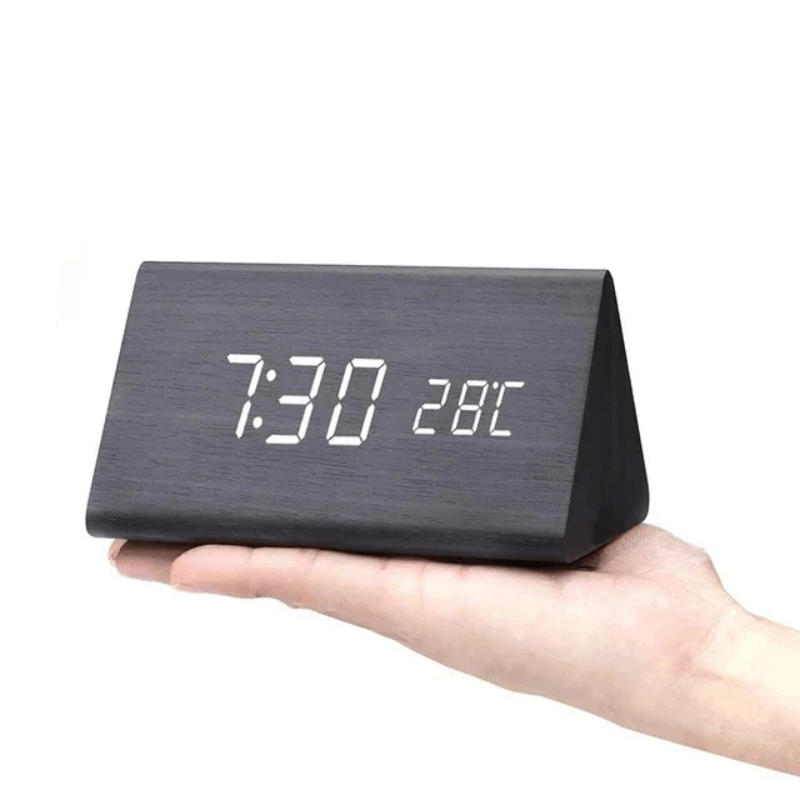 Contemporary voice activated LED wooden clock, combining smart features with natural aesthetics.