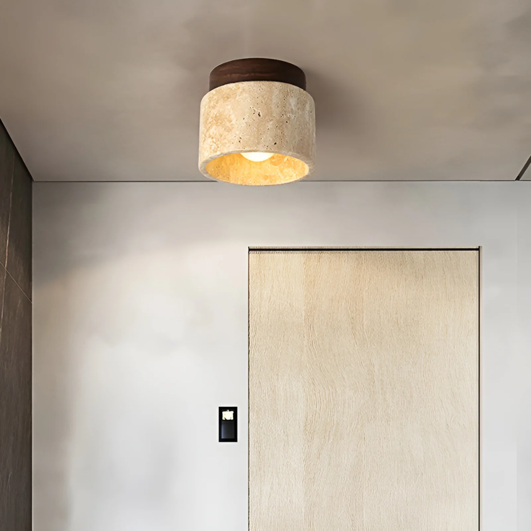Wabi Sabi Japanese ceiling lamp made from natural travertine, casting tranquil ambient LED light for serene home decor.