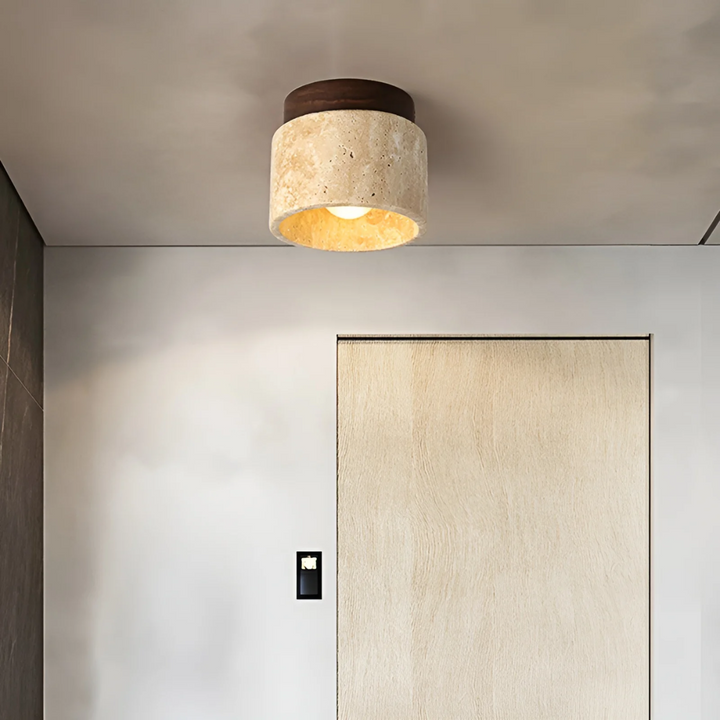 Wabi Sabi Japanese ceiling lamp made from natural travertine, casting tranquil ambient LED light for serene home decor.