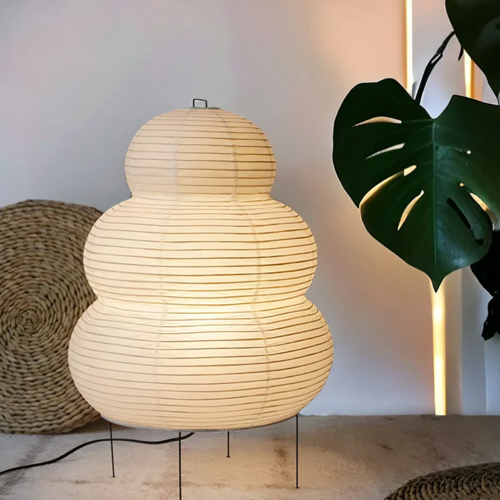 Minimalist Japanese rice paper floor lamp, SereneAura, offering soft ambient light for a tranquil living space.
