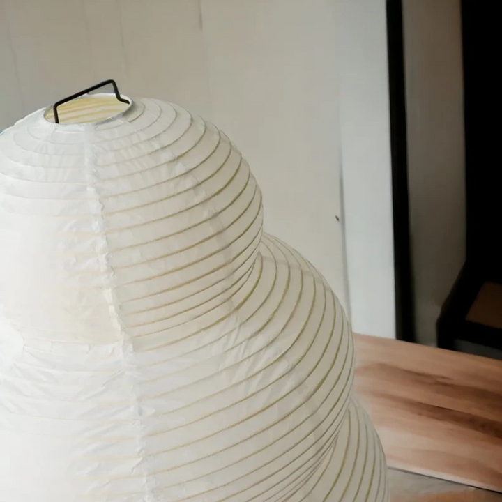 Elegant Wabi-Sabi paper lantern floor lamp, SereneAura, creating a serene glow in any modern living room.