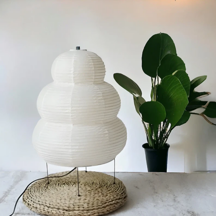 Unique Japanese Wabi-Sabi floor lamp with rice paper shade, providing serene ambient light for home decor.
