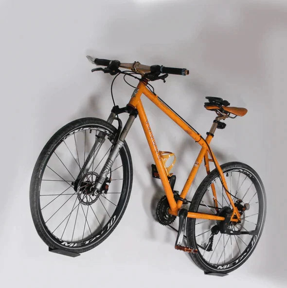 Heavy-duty bike hanger for secure wall-mounted storage. Durable bicycle rack, great for garage organization & space-saving.