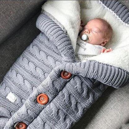 Cozy wrap baby blanket, soft fleece infant swaddle for warmth & comfort. A newborn essential sleep aid.