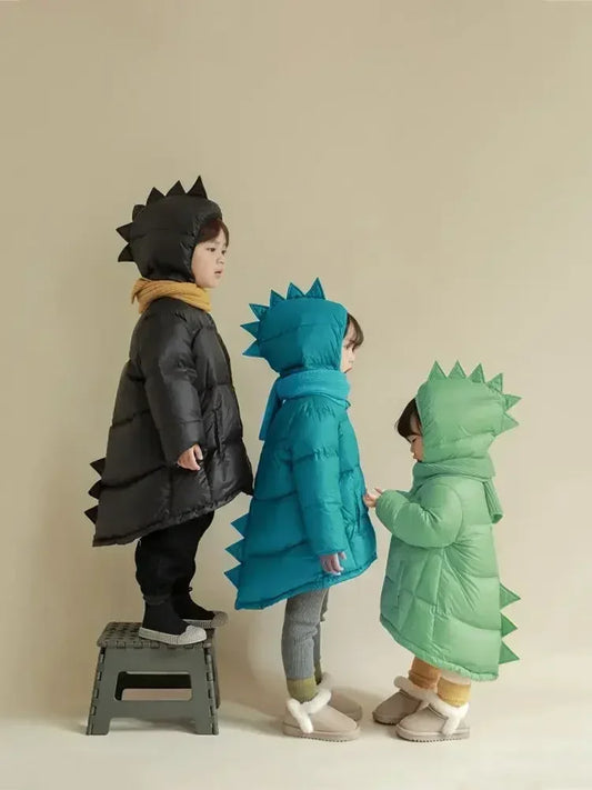 Warm kids' green dino puffer jacket, perfect for playful winter adventures & outdoor fun.