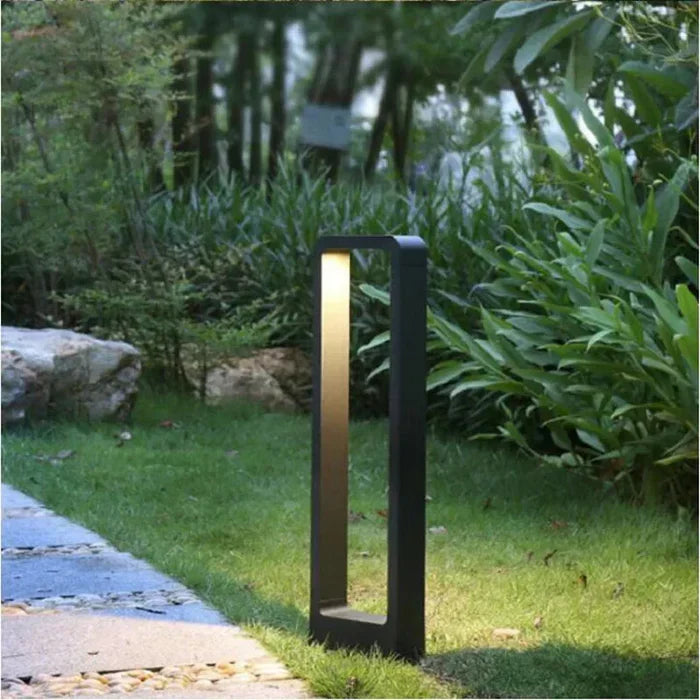Sleek gray waterproof LED ground spot for modern garden and outdoor landscape lighting. Bright pathway illumination.