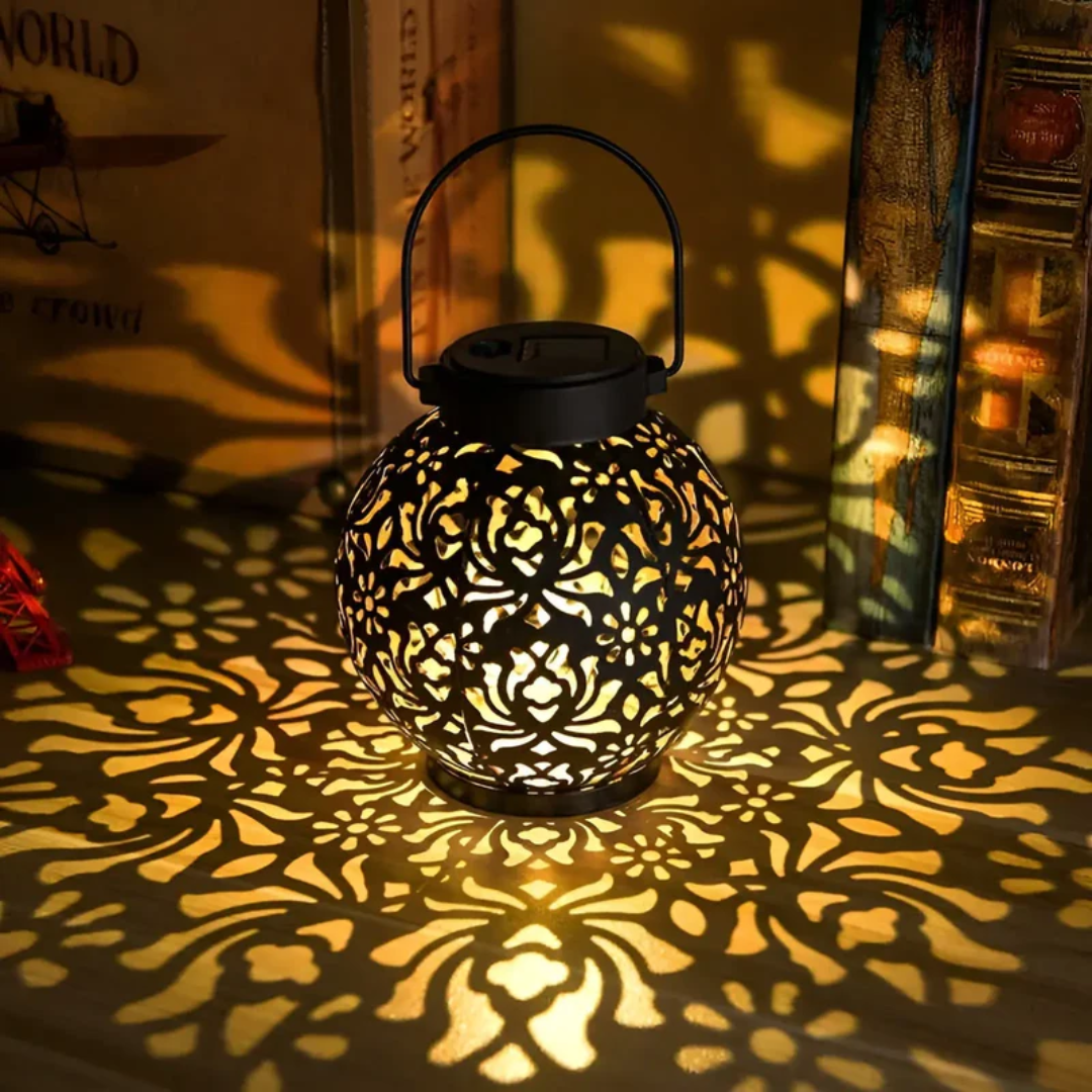 Hanging solar LED light, waterproof & ideal for creating warm ambiance in gardens and on patios.