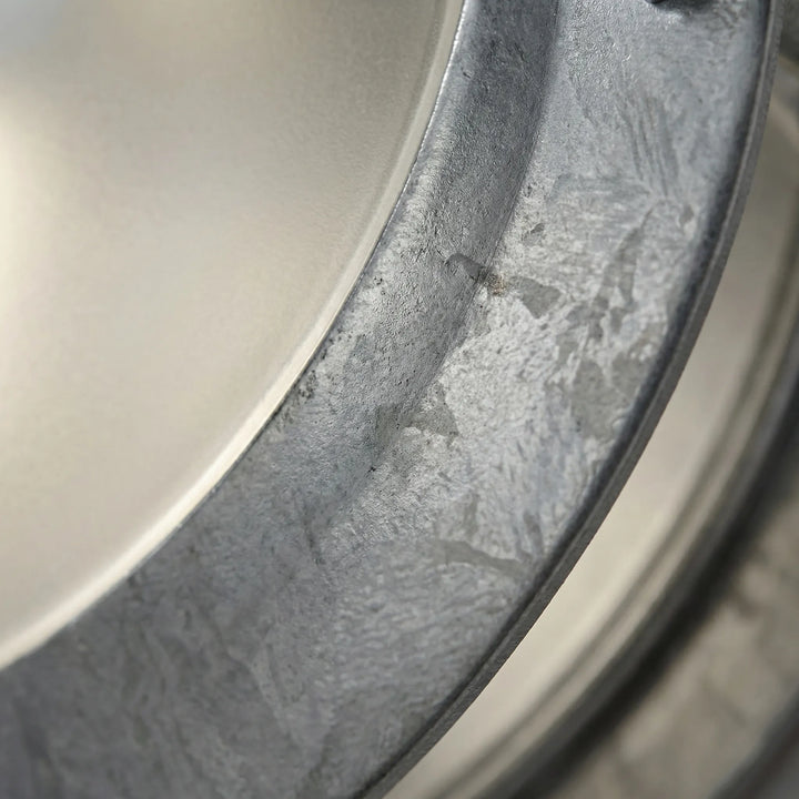Robust galvanized steel round outdoor light. Weatherproof porch and patio lighting for lasting exterior illumination.