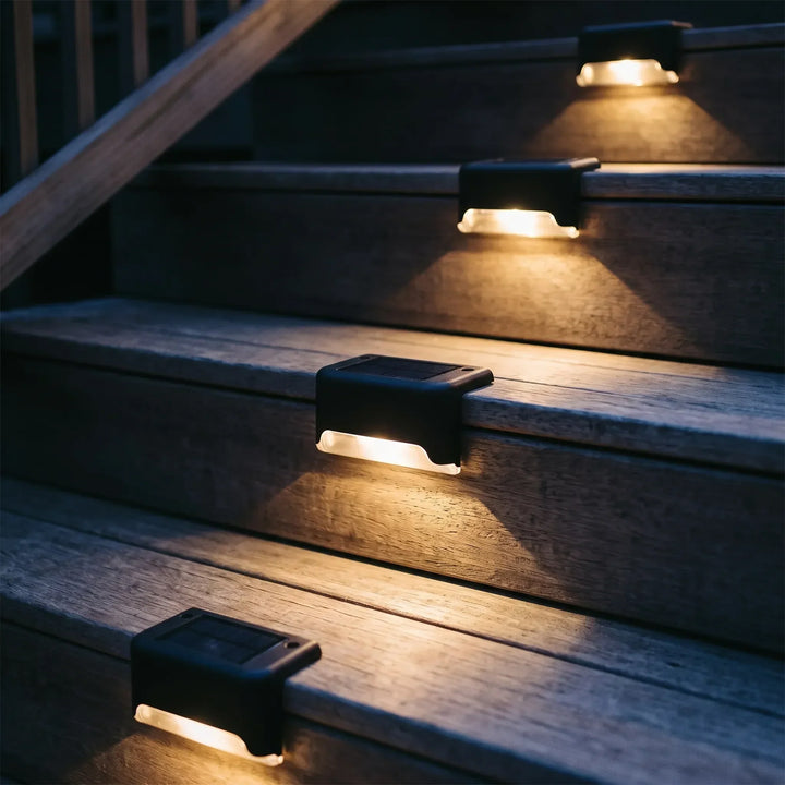 Weatherproof solar LED deck lights illuminate outdoor steps, patios & pathways. Energy-efficient garden landscape lighting.