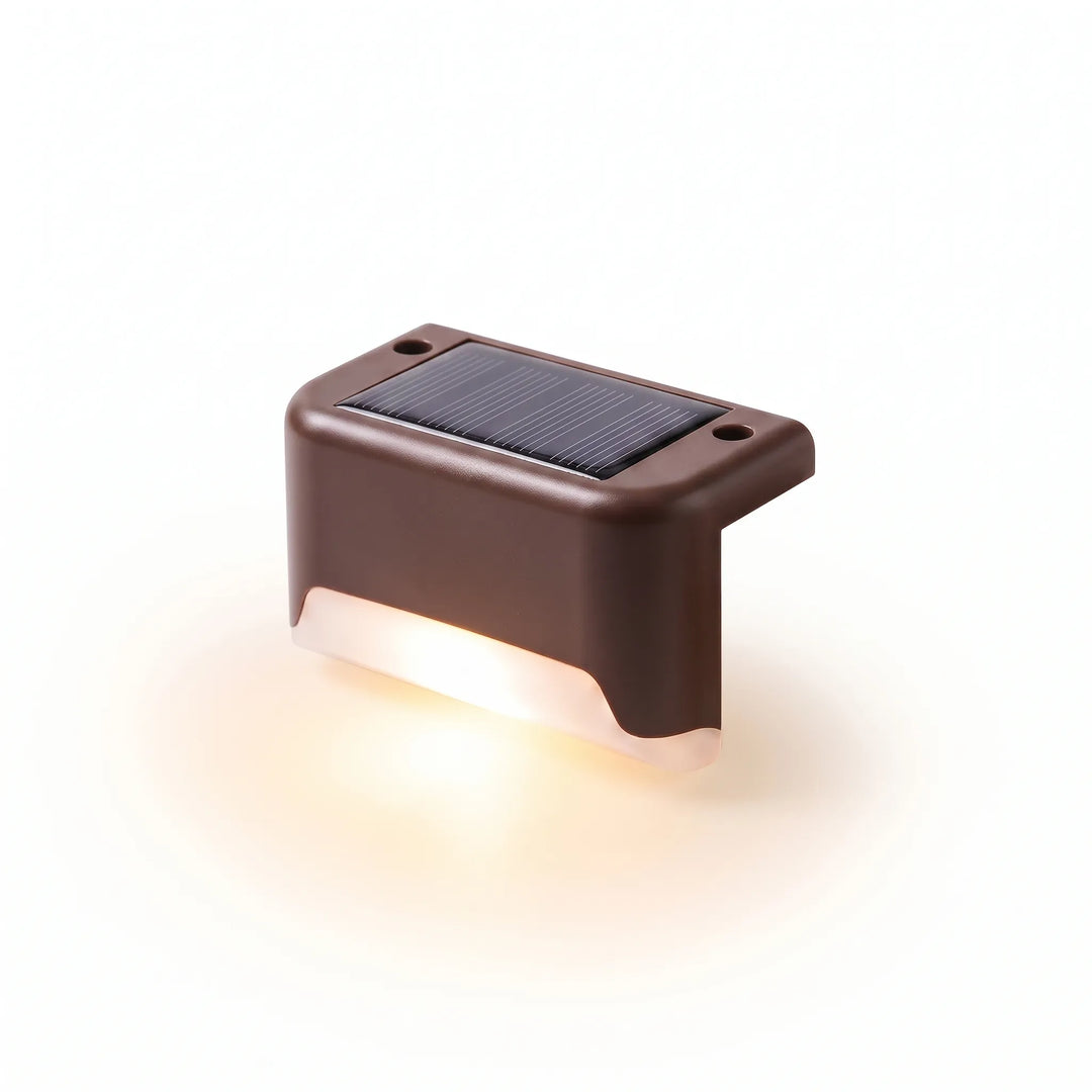 Warm glow solar deck lights brighten outdoor steps & patios at night. Efficient LED landscape pathway lighting for ambiance.