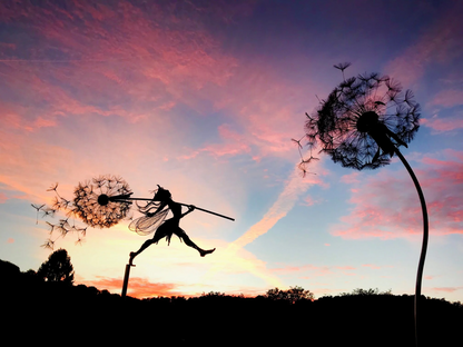 Outdoor art: dancing fairy & dandelion metal sculpture, a whimsical garden decor stake.