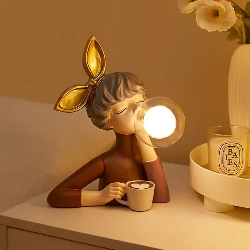 Whimsical girl figurine lamp, a charming resin sculpture creating ambient light, perfect for unique home decor.