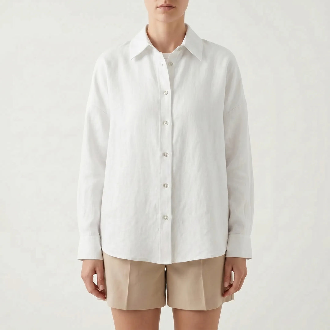Woman models a stylish oversized button-down shirt, a relaxed fit casual top perfect for warm weather or layering.