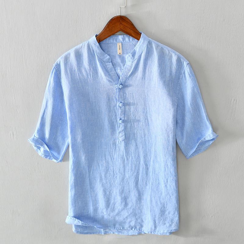 Blue relaxed fit men's button-up shirt, ideal for casual summer. Breathable, versatile collared top.