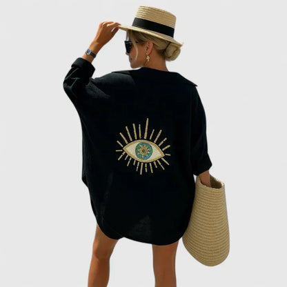 Women's elegant bohemian blouse with relaxed fit, perfect for summer fashion. Embroidered white or sequin black top.