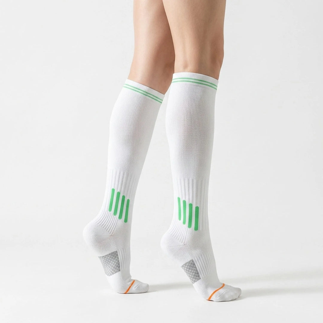 Comfortable women's white knee-high workout socks for active performance.