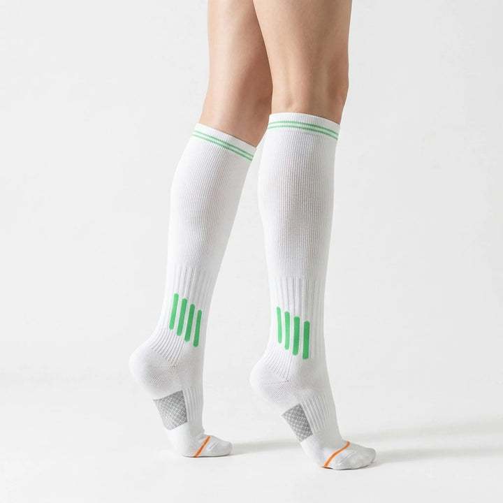 Comfortable women's white knee-high workout socks for active performance.