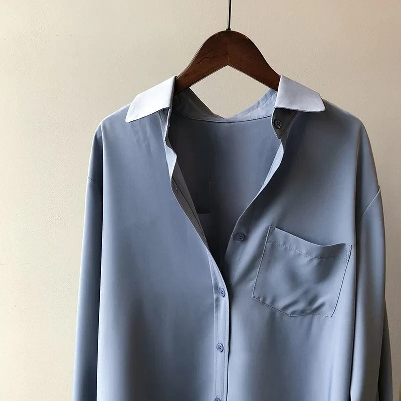 Black Monaco Blouse: elegant women's top for formal events or sophisticated casual chic workwear.