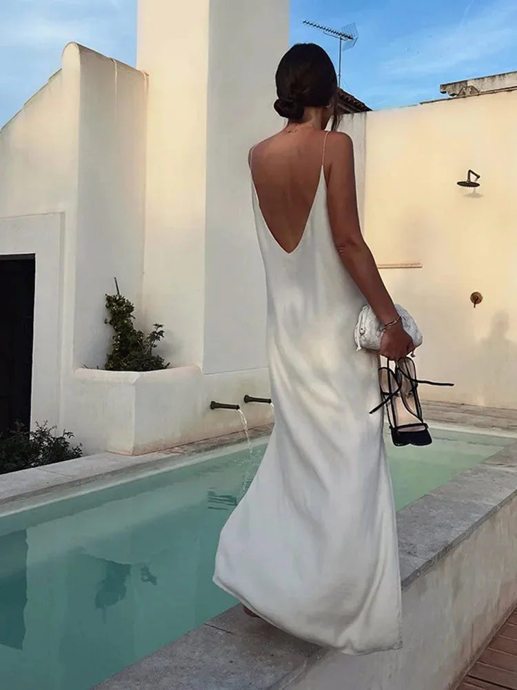 White women's V-neck ankle-length stretch maxi dress. Comfortable & versatile for everyday wear.