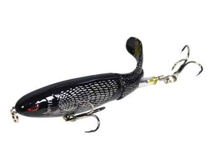 Whopper Plopper topwater bait, rotating tail creates commotion on water surface