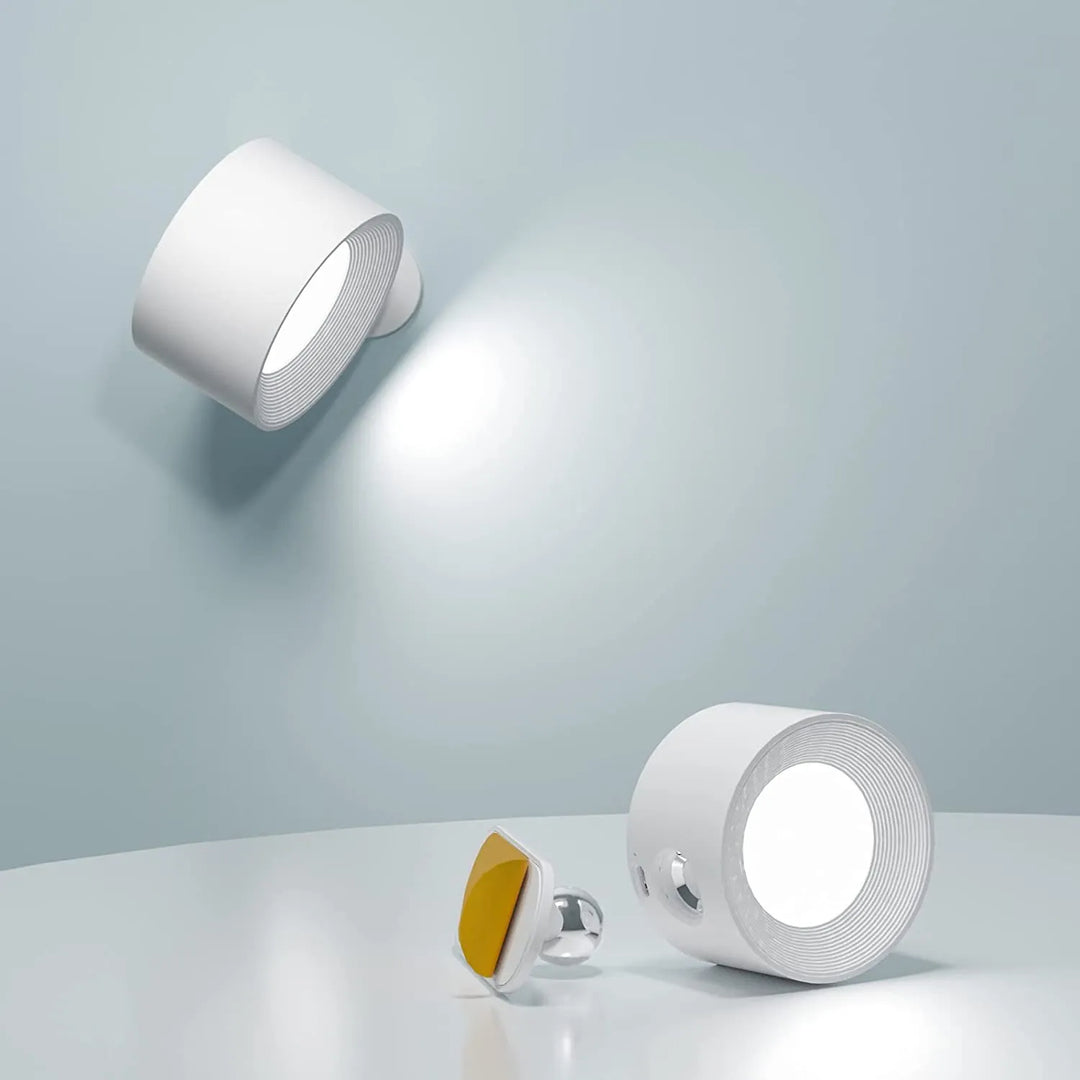 Wireless dimmable wall lamp with 360° rotating head, rechargeable LED light, modern home decor.