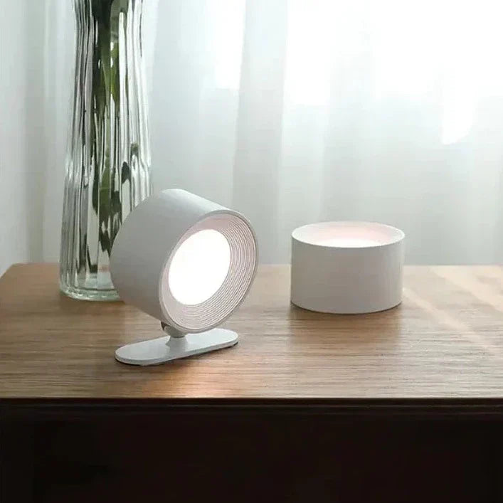 Dimmable LED wall lamp, wireless and rechargeable, 360° rotating head for versatile lighting.