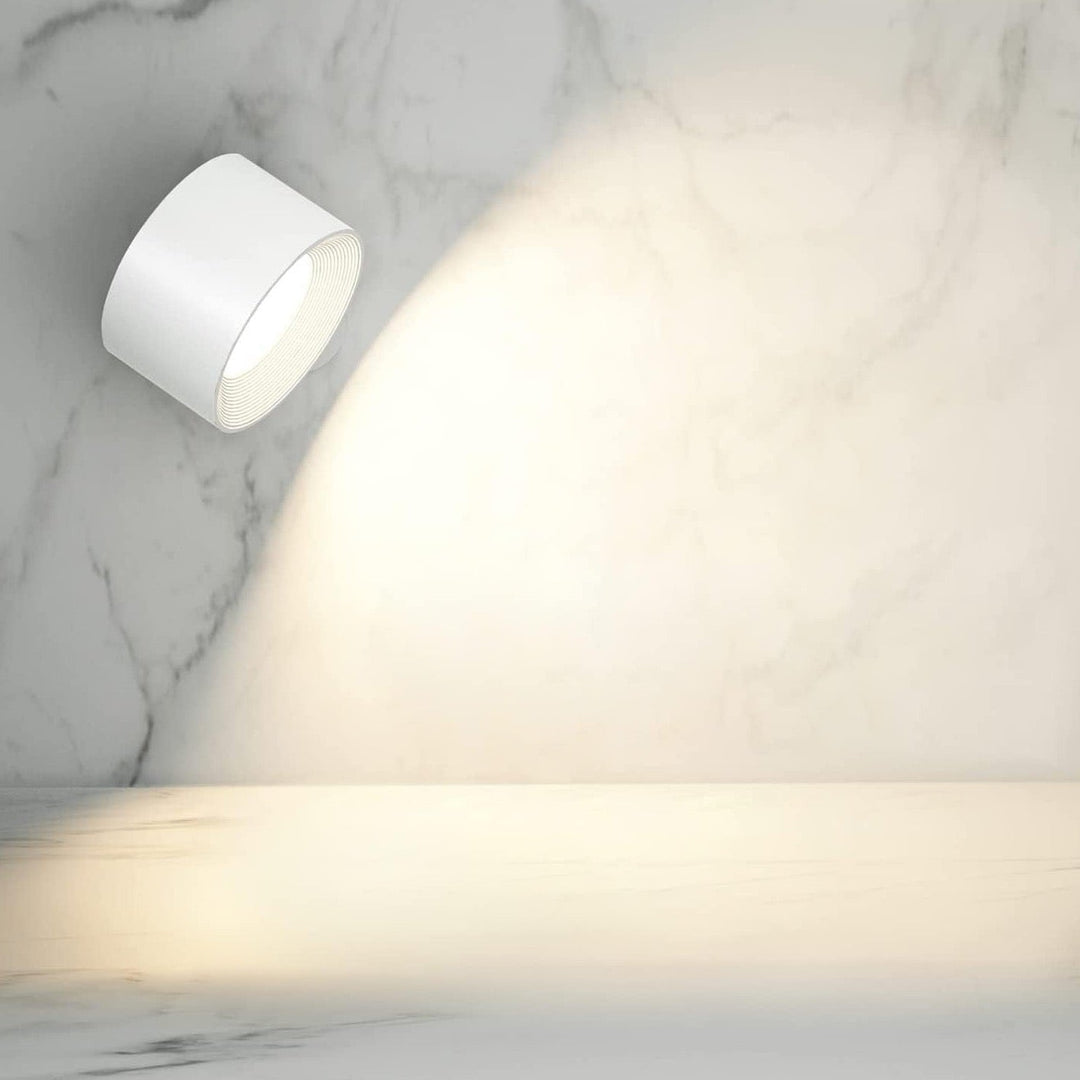 Rechargeable wireless wall lamp, 360° rotating, dimmable LED light for flexible use.