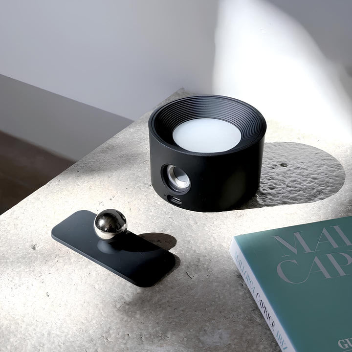 Rechargeable LED wall lamp, wireless, dimmable, 360° rotating head, perfect for home decor.