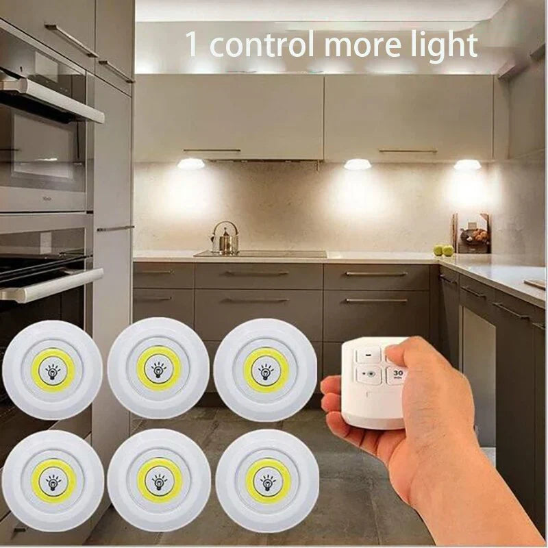 Sleek white wireless LED puck light, battery operated for easy home lighting installation.