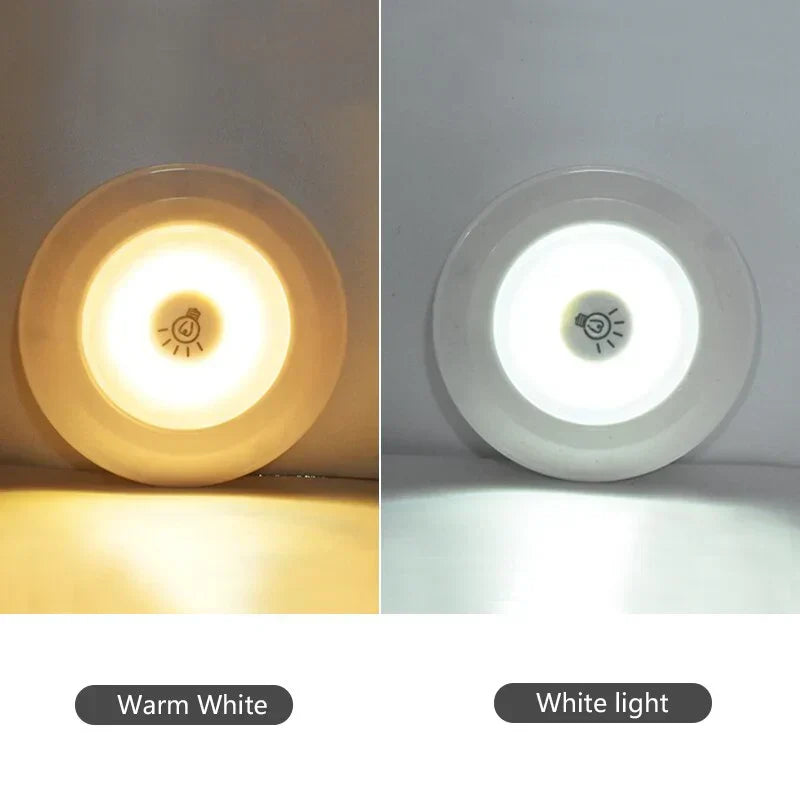 Hand holding remote for LED puck lights, controlling wireless under cabinet & accent lighting.