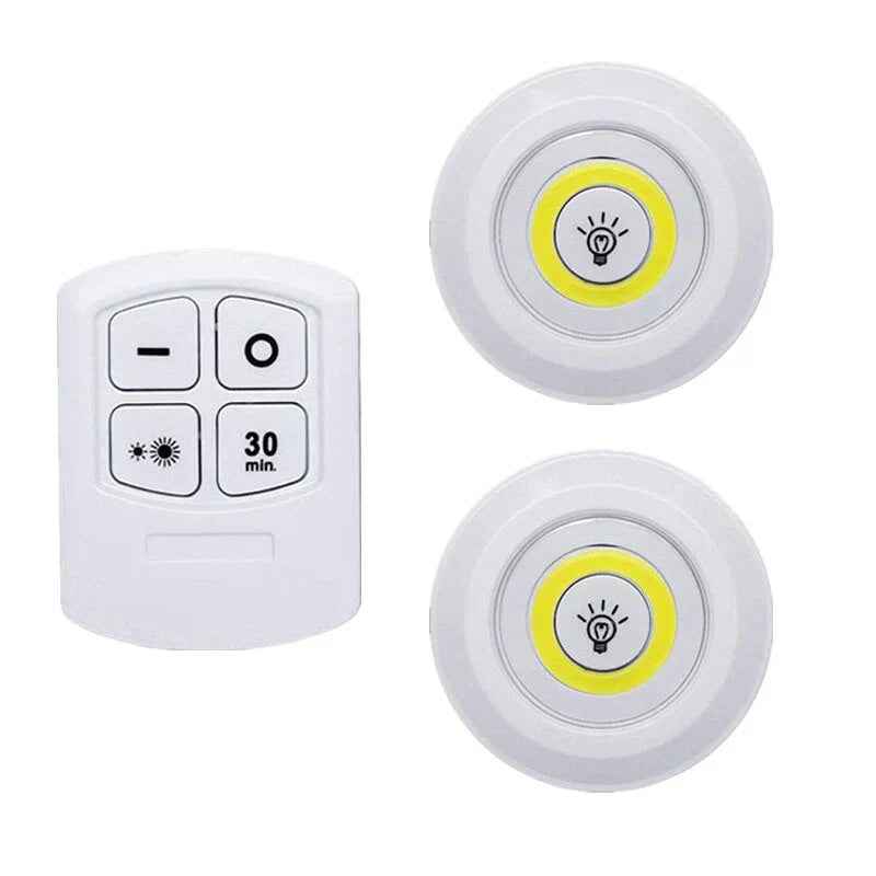 Accent lighting with wireless LED puck lights on a shelf, enhancing home decor with soft glow.