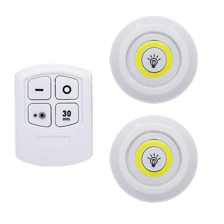Accent lighting with wireless LED puck lights on a shelf, enhancing home decor with soft glow.