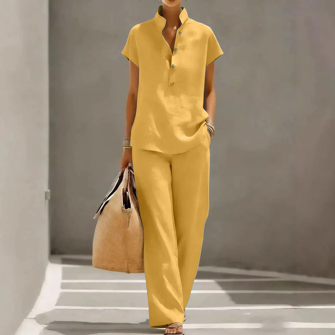 Coordinated women's summer set: short sleeve top and flowing wide-leg pants for casual or resort wear.