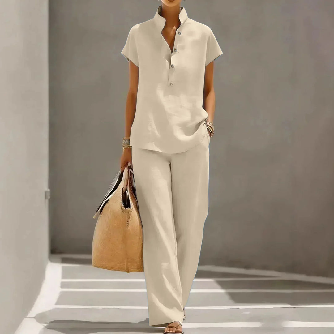 Chic women's two-piece summer fashion set with a short sleeve top and elegant wide-leg pants. Resort style.