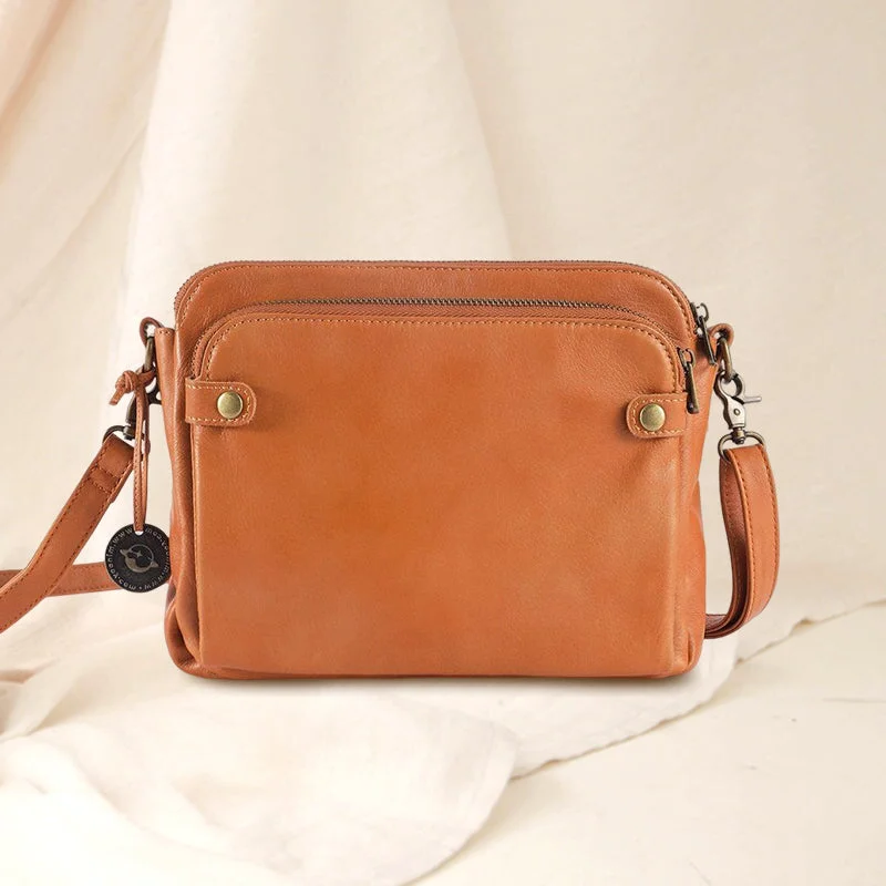 Back view of a versatile women's leather shoulder bag & clutch with three organized layers.