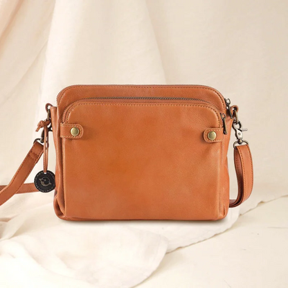 Back view of a versatile women's leather shoulder bag & clutch with three organized layers.