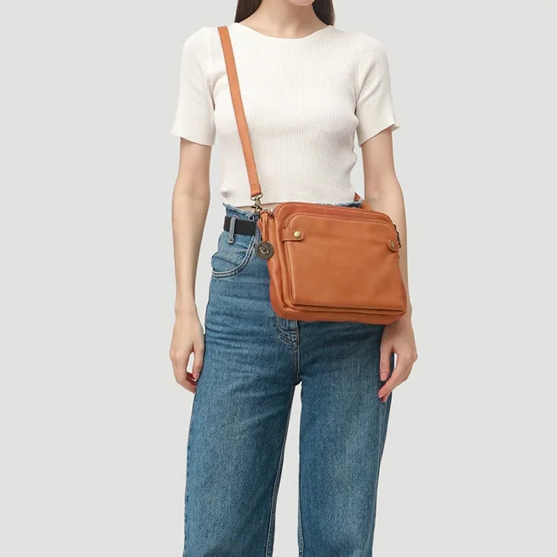 Versatile women's leather clutch & crossbody bag, three layers for superior organization.